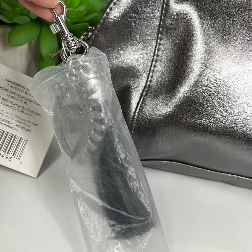 NWT Rodan + Fields Cosmetic Bag Silver with Tassel